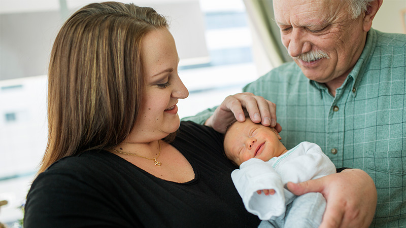 Image of new mother and grandfather